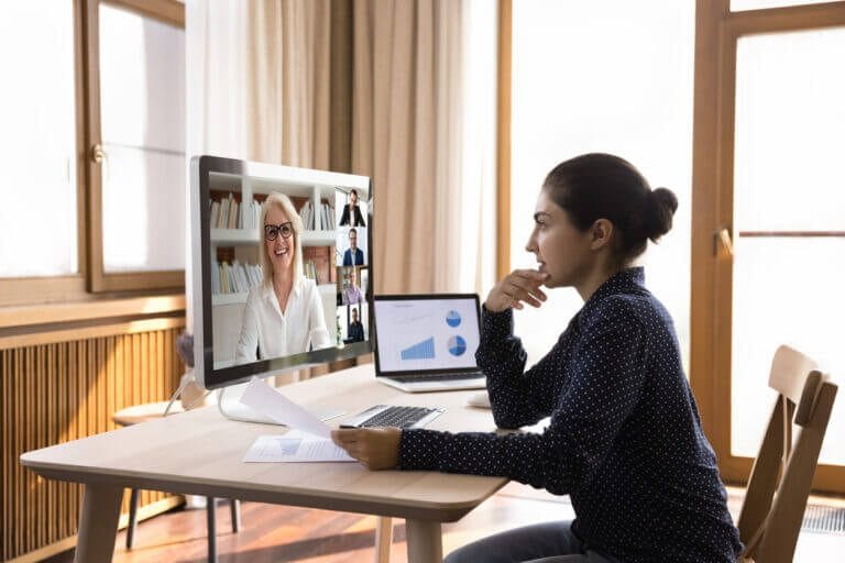 Group of employees on a video conference call discussing cybersecurity.