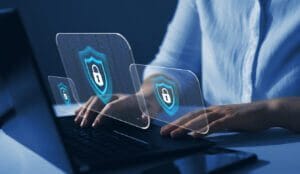 IT consultant reviewing cybersecurity on a computer.
