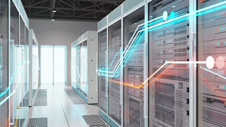 Servers and network equipment in a glass IT closet.