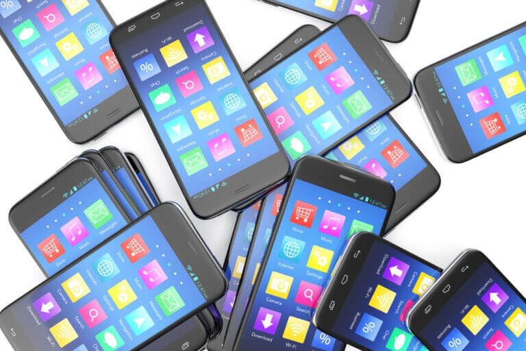 Old mobile phones piled up ready for sale.