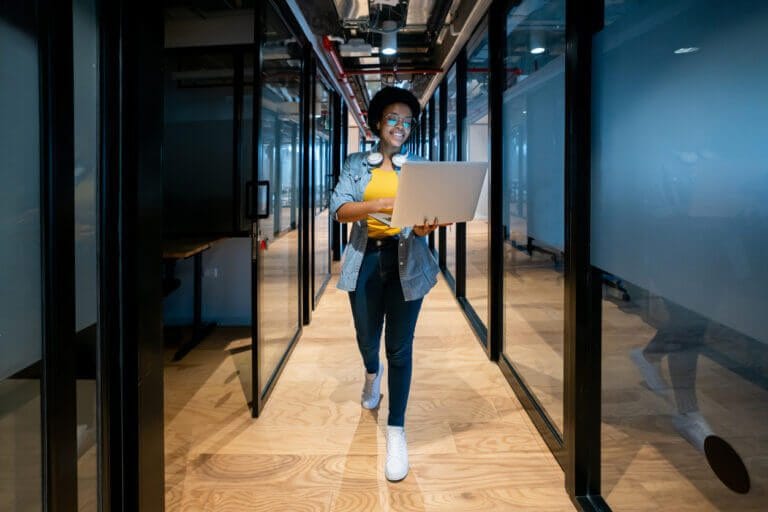 IT employee walking through network/IT closet.