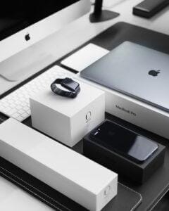 MacBook Pro, watch, and white Apple computer.