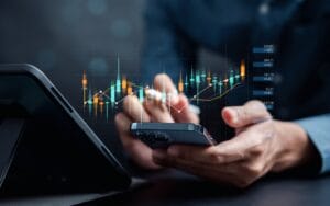 Business associate working on financial service documents from mobile device.
