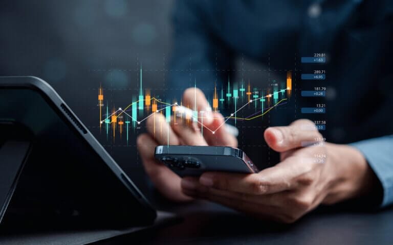 Business associate working on financial service documents from mobile device.