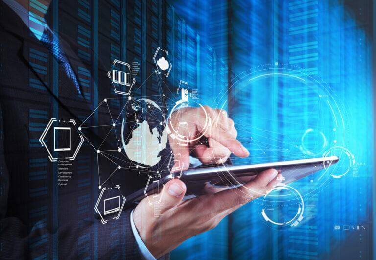 Man in a suit touching a tablet with digital coding graphics around him.