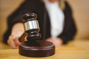 Woman holding gavel.