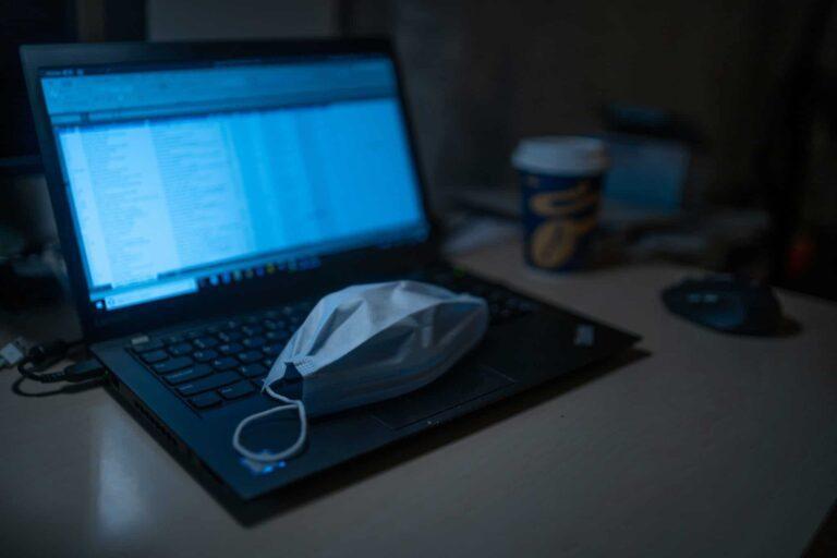 Mask laying on top of computer keyboard