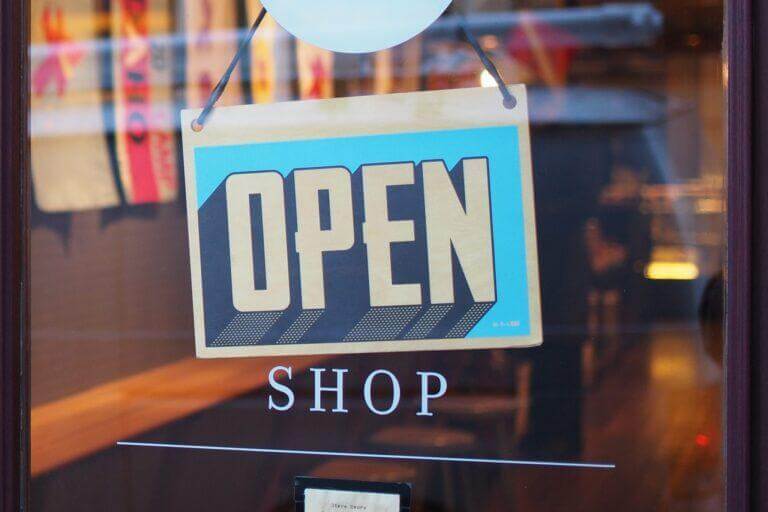 Retail shop with an Open sign.