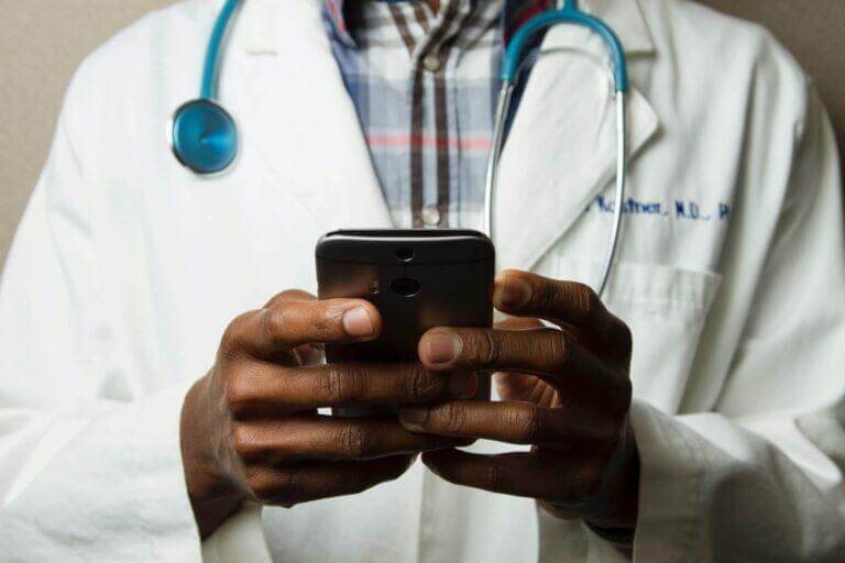 Doctor from the National Cancer Institute working on a mobile device.