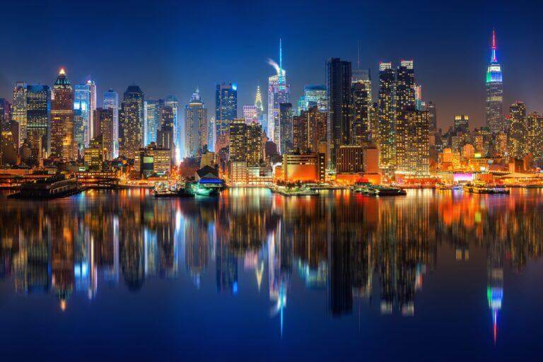 City and bay skyline at night.