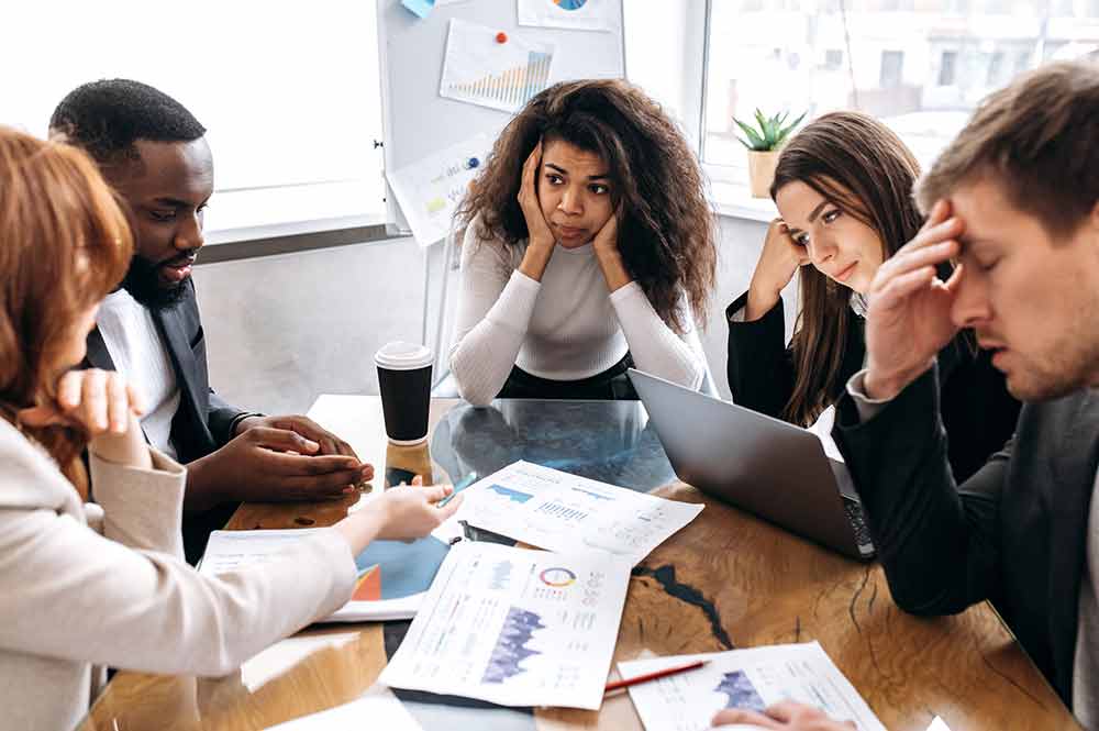 Group of people engaged in stressful discussion